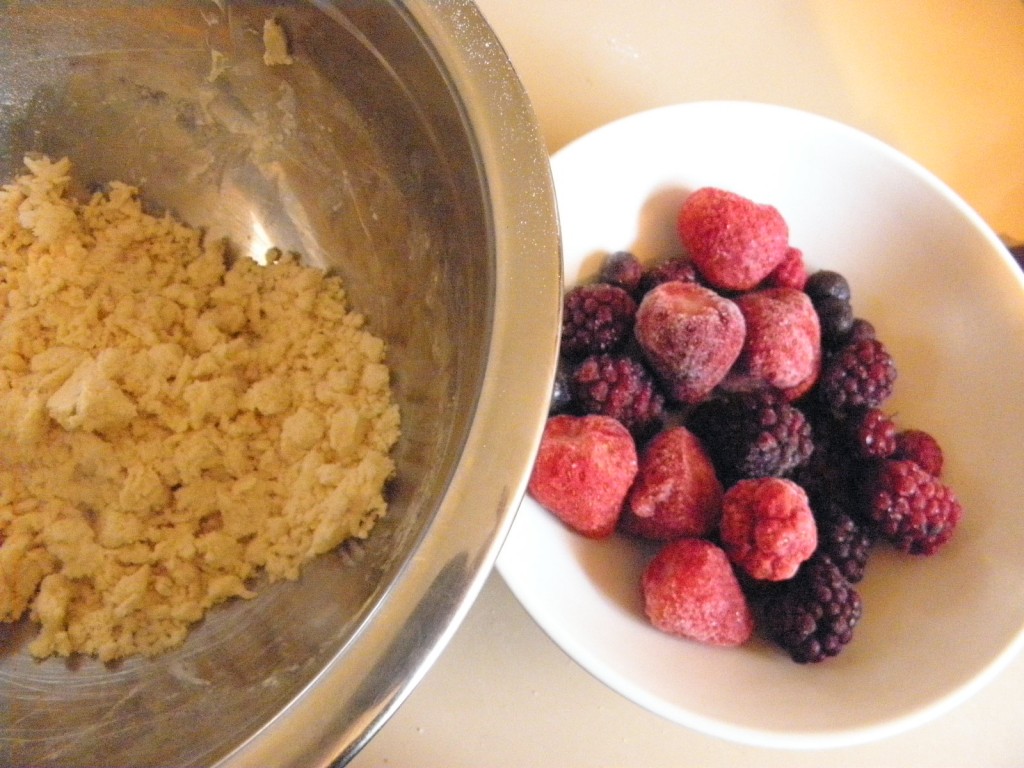 flour crumble and bowl of frozen berries
