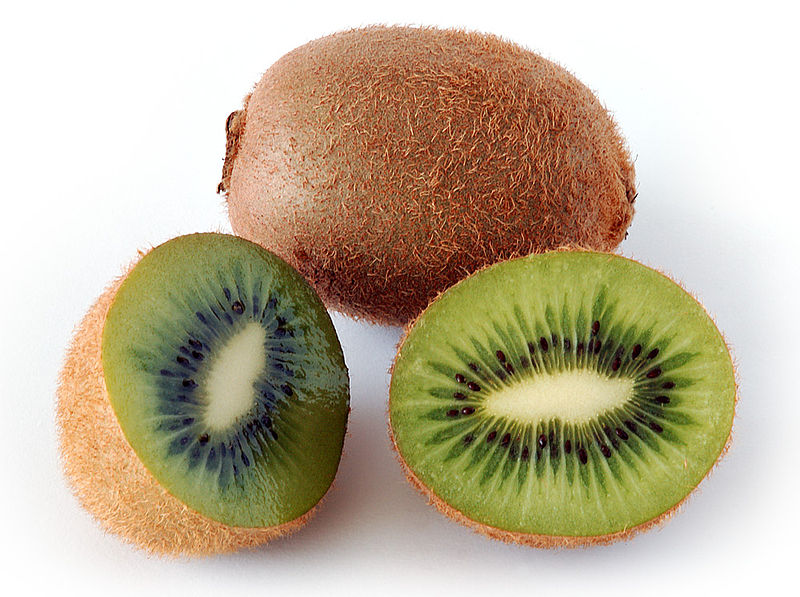 cut and whole kiwi fruits