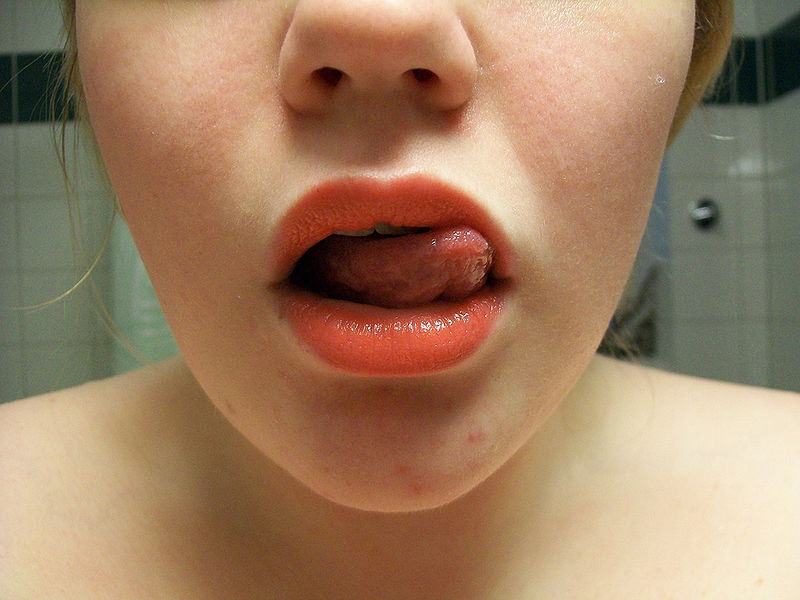 child poking tongue out