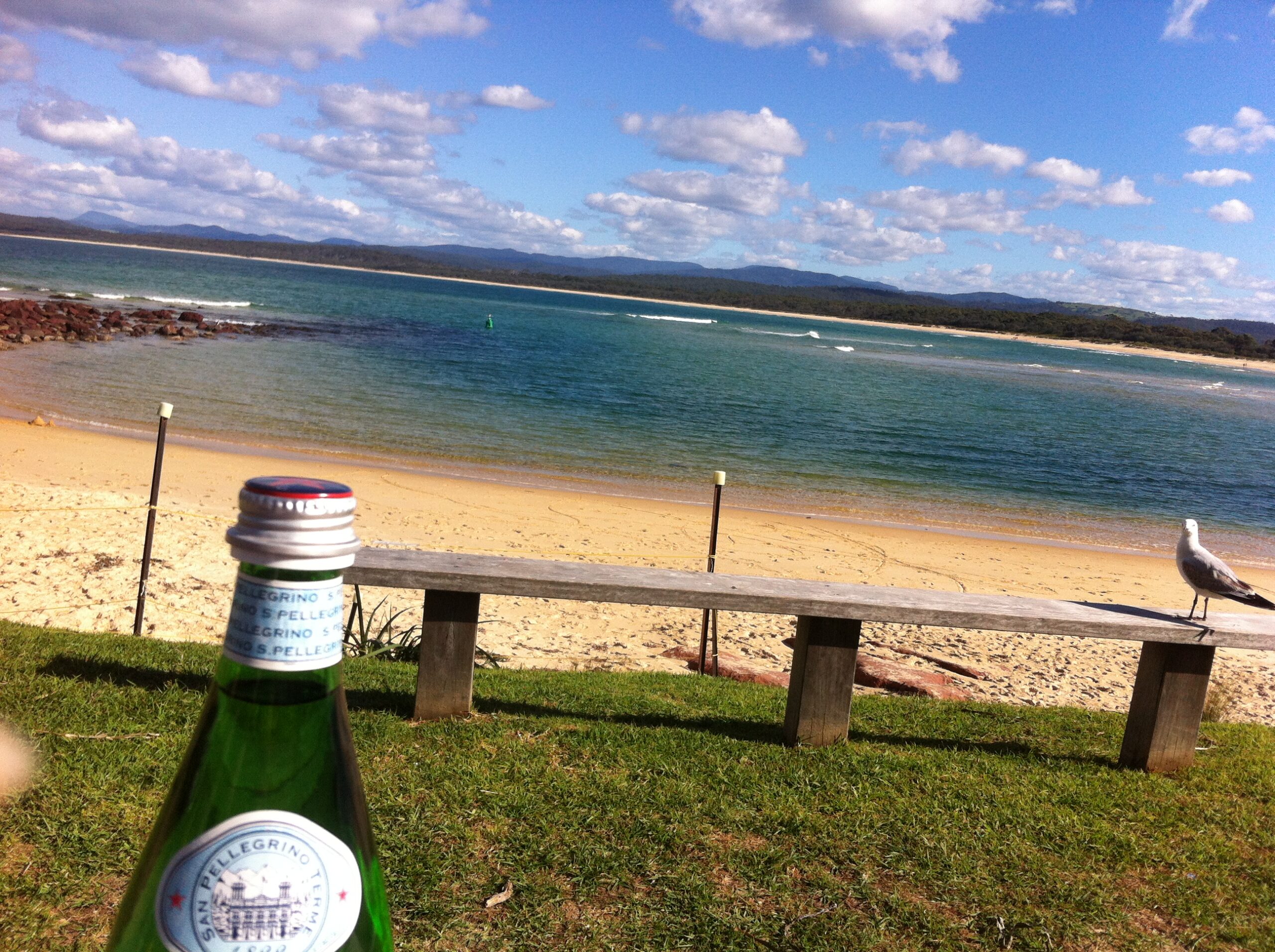 view across the bar with mineral water in foreground