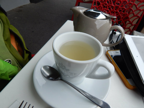 Cup of lemongrass and ginger tea and pot, nicotine withdrawal