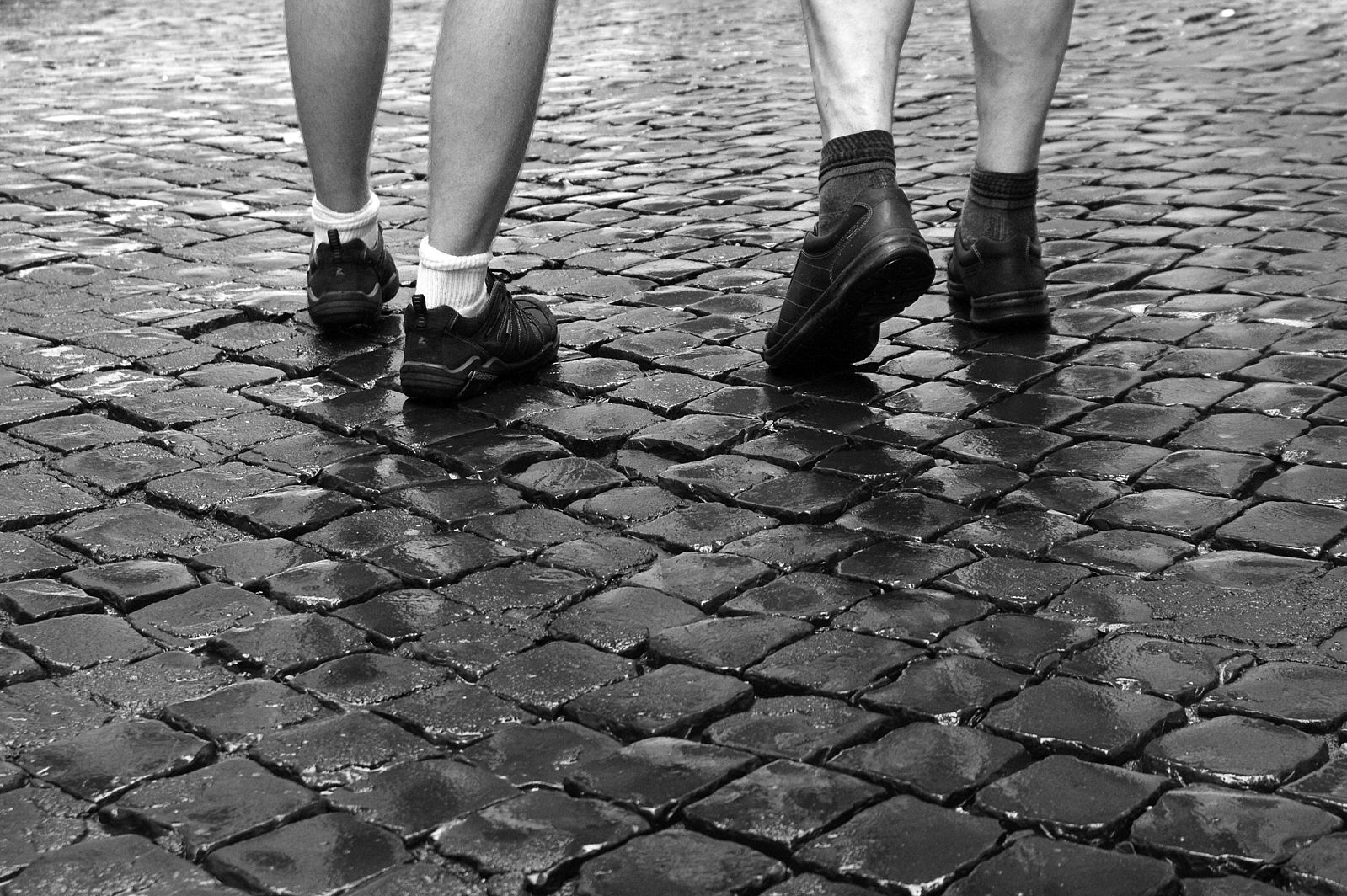 walking 10,000 steps per day for activity requirements - walking on cobblestones in Rome