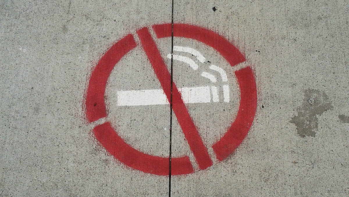 quitting cigarettes with NRT - the sign on concrete