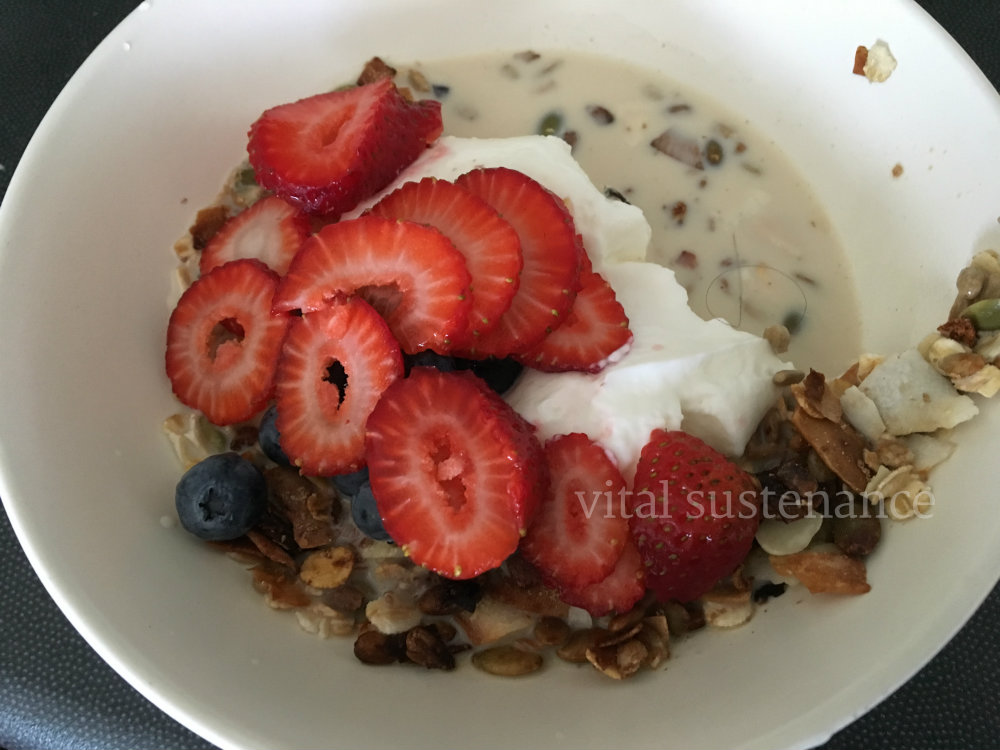 bowl of cereal, milk, yoghurt and berries - high protein breakfast cereal