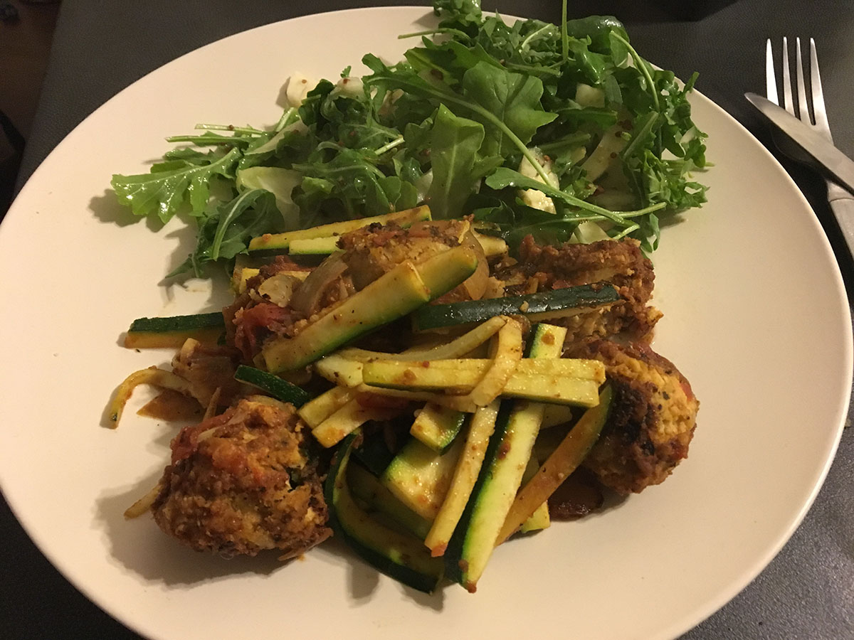 plate of salad, meatballs and zucchini 'pasta' for a low carb vegetarian dinner