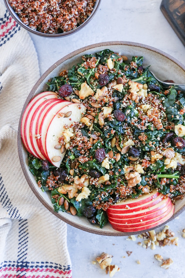 winter vegetarian seasonal recipes - kale and quinoa salad recipe with cranberries, apples and walnuts
