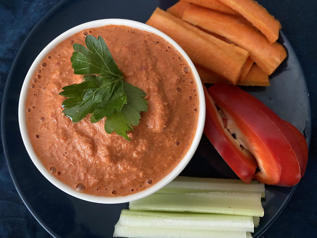 vegan spicy capsicum dip with cut veggie sticks