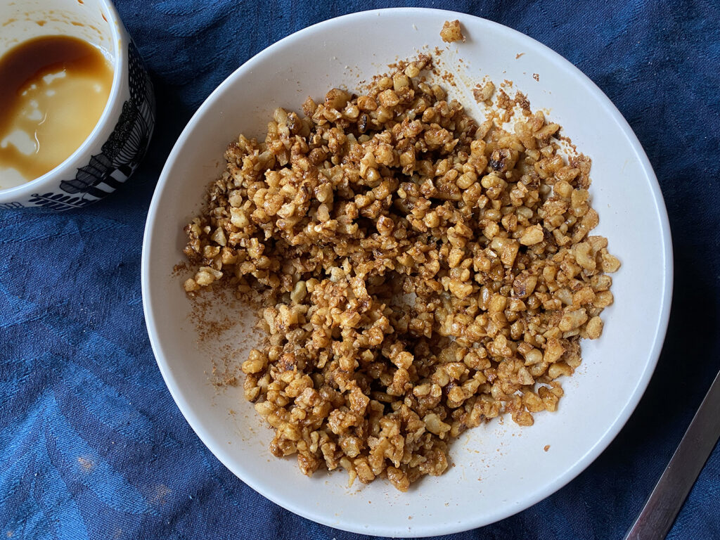 walnut meat recipe - complete walnut taco meat in a bowl with empty tamari bowl nearby