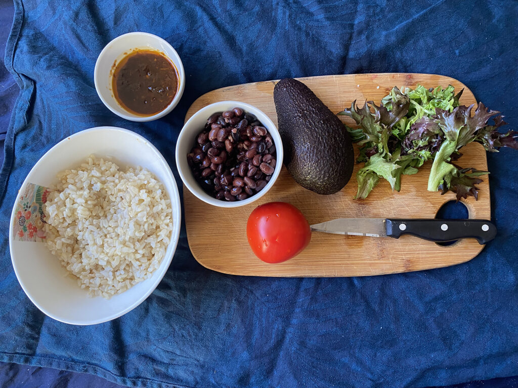chipotle burrito bowl ingredients - rice, black beans, chipotle sauce, tomato, avocado, lettuce, all you need for this delicious chipotle bowl recipe 