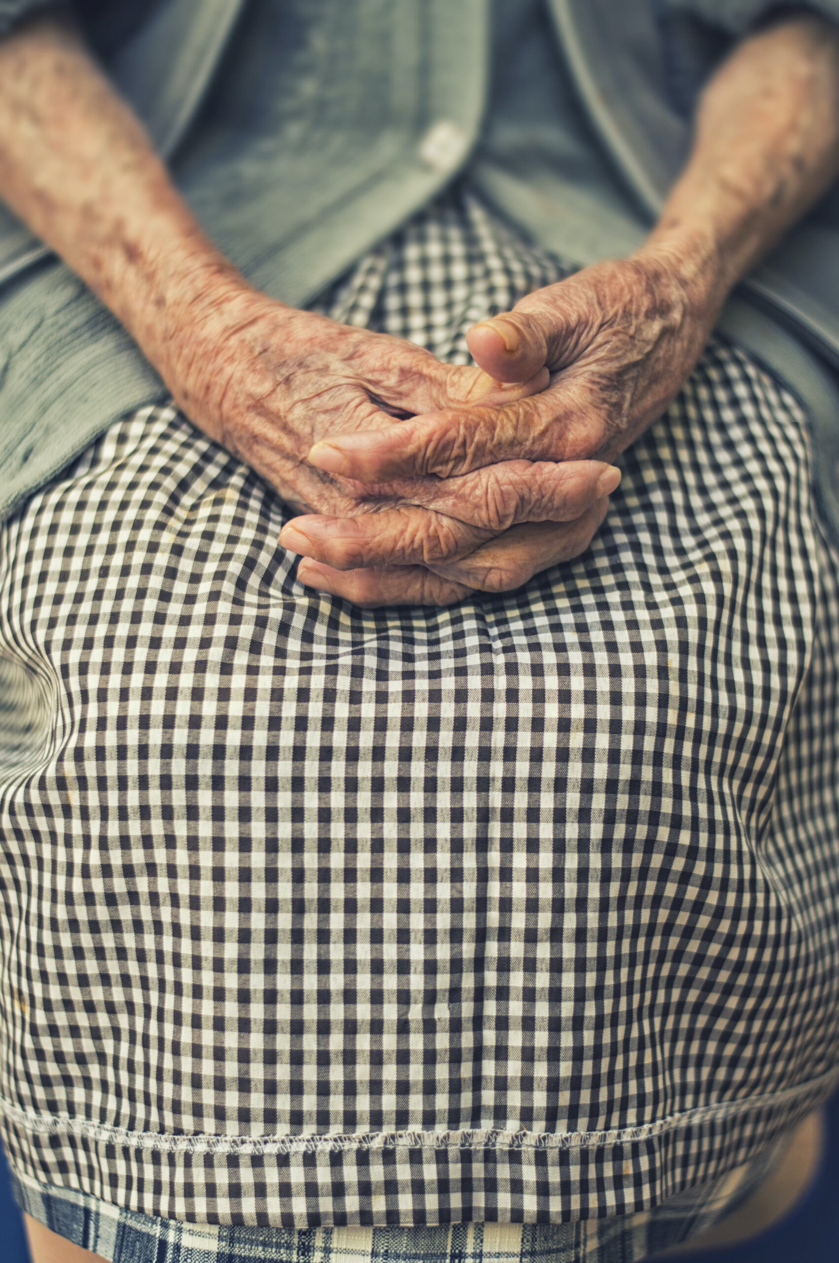 eating for longevity - what would ally do? - an elderly woman's hands in her skirt