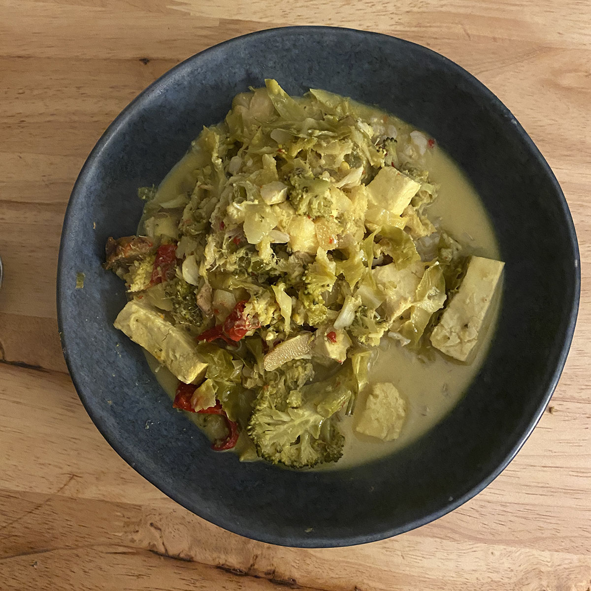 coconut fish curry with lemongrass, broccoli, snow peas, chilli and turmeric