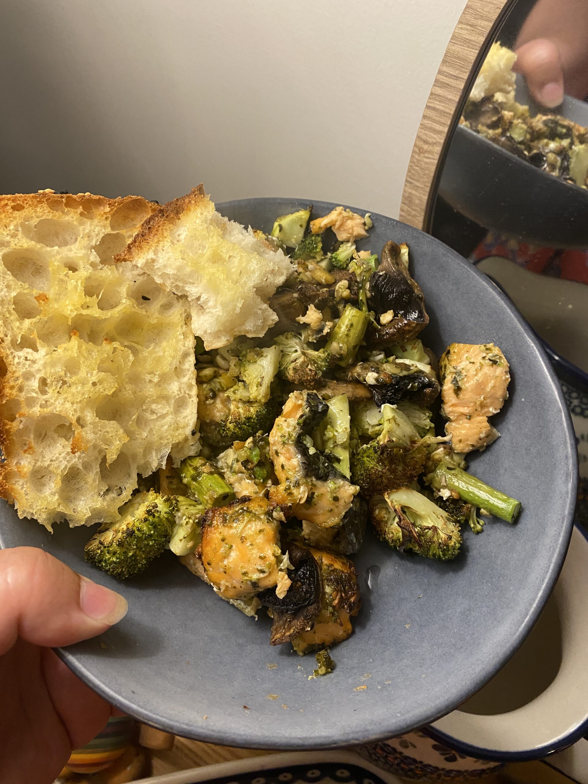 pesto salmon and garlic bread with pesto veggies