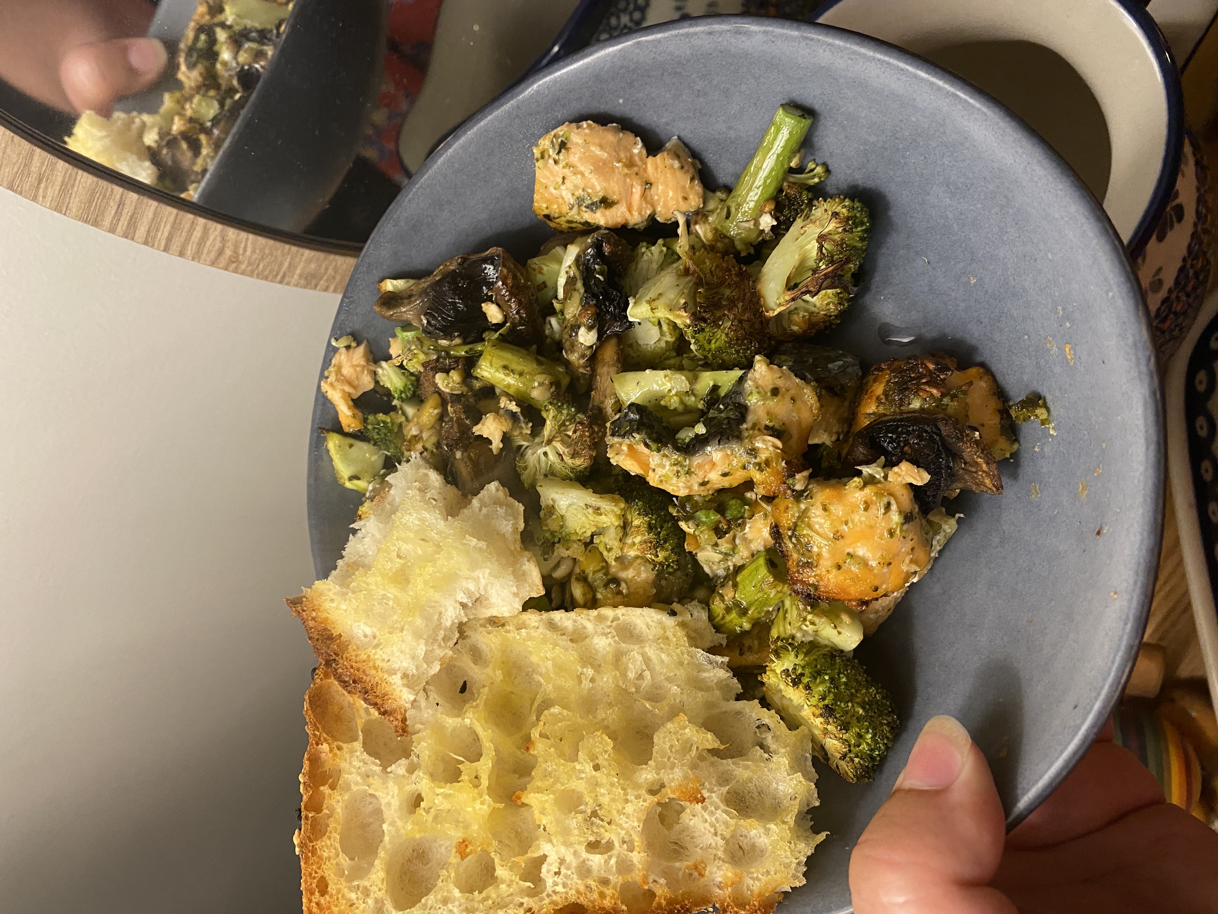 pesto salmon and garlic bread with pesto veggies