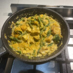 pumpkin and tofu green curry in frypan