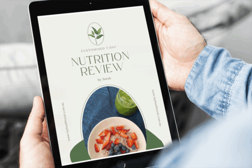 man holding 7-day nutrition review report on an ipad