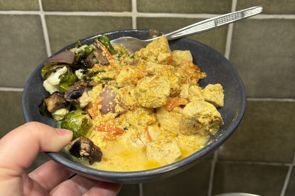delicious yoghurt chicken curry with roasted vegetables