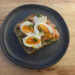 pesto toast recipe - piece of toast with salmon, goat's cheese, pesto and dill - to highlight the high protein breakfast benefits